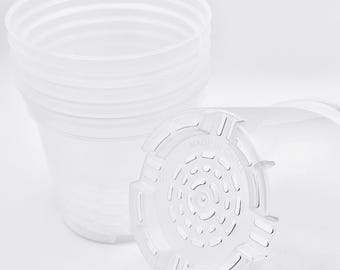 May include: A set of four clear plastic plant pots with drainage holes. The pots are stacked on top of each other. The bottom pot has the words "Made in China" printed on the bottom.