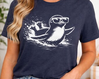 Surfing Penguin T-shirt | Cool Graphic Animal Tee | Gift for Surfers and Ocean Lovers