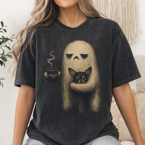 Ghost holding chihuahua and coffee cup with "MEH" text.
