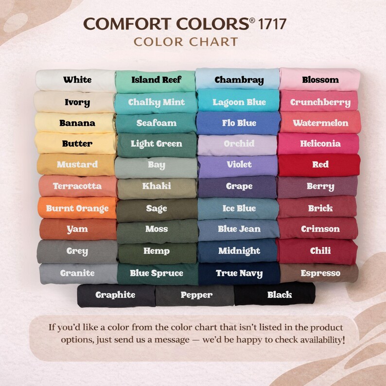 May include: A Comfort Colors 1717 color chart displaying folded fabric swatches in various shades including white, ivory, banana, butter, mustard, terracotta, burnt orange, yam, grey, granite, mint, seafoam, bay, khaki, sage, moss, hemp, blue spruce, graphite, pepper, black, chambray, lagoon blue, flo blue, orchid, violet, grape, ice blue, blue jean, midnight, true navy, blossom, crunchberry, watermelon, heliconia, red, berry, brick, crimson, chili, and espresso.