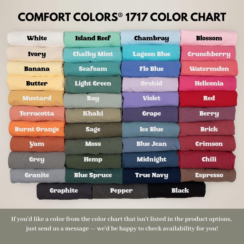 May include: Color chart featuring a variety of Comfort Colors 1717 shades, including white, black, and various hues of blue, green, and pink. The chart displays the names of each color, such as "Chambray" and "Blossom".