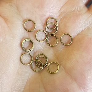 Anelli di salto da 7 mm - Bronzo antico placcato - Risultati di gioielli forti - 100 pezzi