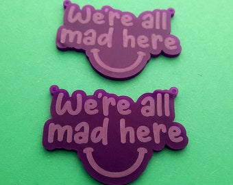 2 x Laser cut acrylic We're All Mad Here pendants