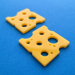 2 x Laser cut acrylic swiss cheese slice pendants