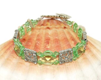 Green Bracelet With Crystals By Swarovski, Rhinestones And A Hummingbird Toggle Clasp