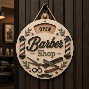 May include: A circular wooden barber shop sign displaying the text OPEN, Barber, and Shop. The design features two barber poles with red, white, and blue stripes, a pair of scissors, a comb, a straight razor, and a moustache icon with small stars and leaves.