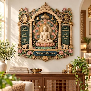 May include: A decorative wall plaque featuring a central seated figure in a lotus position, surrounded by a colorful lotus flower motif, hanging bells, and two elephants. The plaque includes Sanskrit text, a hand symbol, and the words Navkar Mantra.