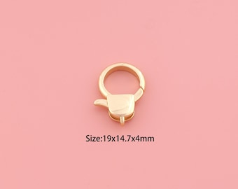 May include: A gold-colored clasp with a rounded ring and a rectangular base. The clasp is 19mm x 14.7mm x 4mm in size. The background is a solid pink color.