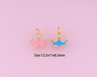 May include: Two gold-colored crown charms, one with pink enamel and one with blue enamel. The charms are 12.5 mm x 11 mm x 6.5 mm in size.  Size: 12.5x11x6.5mm