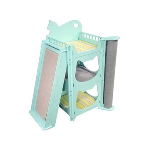 May include: A multi-level cat tree in a light teal color. It features a slide with a scratching surface, multiple platforms with striped cushions, and a sisal scratching post. The top has a cat silhouette cutout.