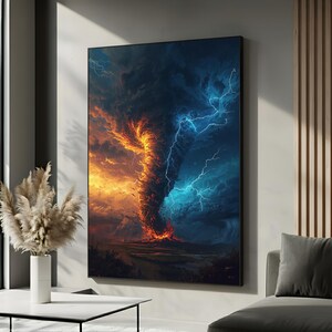 May include: A framed canvas print depicting a dramatic tornado with a fiery orange and blue color scheme. The artwork showcases a swirling vortex of fire and lightning, set against a dark, stormy sky. The print is displayed on a neutral-colored wall.