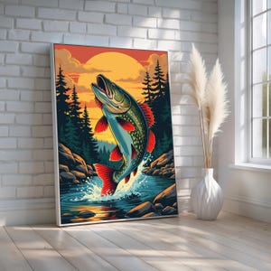 May include: A framed art print depicts a leaping fish in a vibrant outdoor scene. The fish is blue, green, and red, set against a backdrop of a sunset, trees, and water. The artwork is displayed on a white wall.