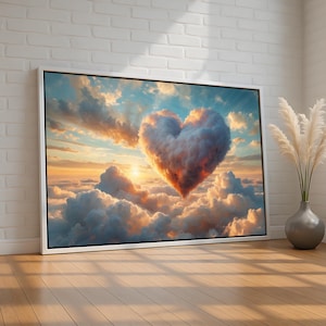 May include: A framed canvas print featuring a heart-shaped cloud formation against a backdrop of a sunset sky. The artwork showcases a vibrant display of colors, including shades of orange, blue, and white, creating a romantic and serene atmosphere. The print is displayed on a wooden floor.