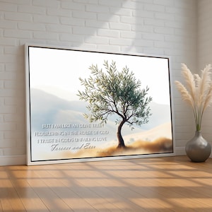 May include: A white canvas print with a painting of an olive tree in a field. The print has a quote from the Bible: "But I am like an olive tree flourishing in the house of God. I trust in God's unfailing love Forever and Ever." Psalm 52:8