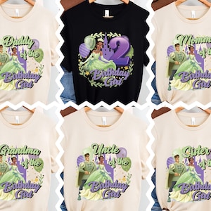 May include: Six different t-shirt designs featuring a cartoon princess and prince. The shirts are beige, black, and green. The text on the shirts reads "Daddy of the Birthday Girl", "Mommy of the Birthday Girl", "Grandma of the Birthday Girl", "Uncle of the Birthday Girl", "Sister of the Birthday Girl", and "2 Birthday Girl".