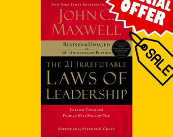 May include: A red book cover with the title "The 21 Irrefutable Laws of Leadership" by John C. Maxwell. The book is a revised and updated 10th anniversary edition with a foreword by Stephen R. Covey.