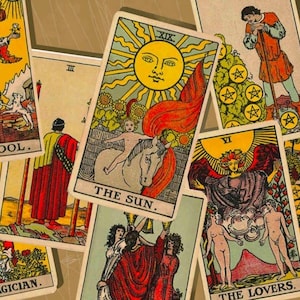 May include: A collection of tarot cards featuring illustrations and text. The cards include "The Fool," "The Sun," "The Magician," and "The Lovers." The artwork is colorful, with images of figures, symbols, and celestial bodies.