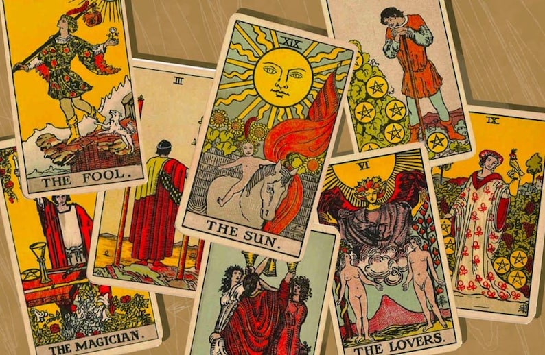 May include: A collection of tarot cards featuring illustrations and text. The cards include "The Fool," "The Sun," "The Magician," and "The Lovers." The artwork is colorful, with images of figures, symbols, and celestial bodies.