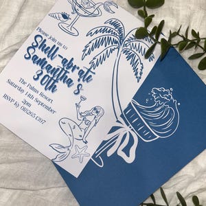 May include: A blue and white invitation card with a mermaid, palm tree, and wave design. The text on the card reads "Please join us to Shell-abrate Samantha's 30th. The Palms Resort. Saturday 14th September 2pm. RSVP Ky 018265 1397."