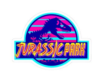 May include: A retro-style Jurassic Park logo with a blue dinosaur skeleton against a pink and blue striped background. The text "Jurassic Park" is in yellow, red, and purple letters.