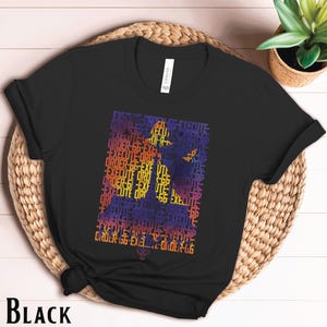 May include: Black t-shirt with a graphic design of a person in a silhouette made up of the words "Execute Order 66".