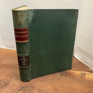 May include: A hardbound volume of Engineering News Record, Volume 108, covering January to June 1932. The book features a dark green cloth cover and a spine with red and black labels containing gold text, including the name F. W. Harvey.