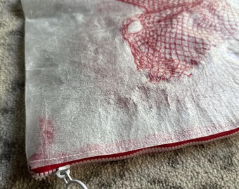 White and red netting Upcycled water resistant zipper pouch