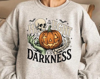 He Is The Light In The Darkness Shirt, Christian Skeleton Pumpkin Cross Tee, Faith Hoodie, Funny Halloween Sweatshirt, Religious Gift