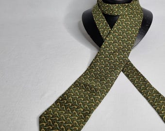 May include: A green patterned necktie with a wave-like design. The tie is tied in a knot and displayed on a black stand.