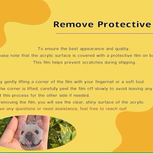 May include: A yellow graphic with instructions on removing protective film from an acrylic surface. The text details how to peel the film to ensure the product's best appearance. A keychain with a dog's face is shown.