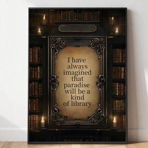 May include: A rectangular wall art print featuring a central parchment-coloured panel with the text I have always imagined that paradise will be a kind of library, framed by ornate dark metal scrollwork against a backdrop of dark library shelves.