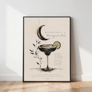 May include: A framed wall art print on a cream background featuring a black ink illustration of a margarita glass with a lime slice, a crescent moon, and botanical sprigs. Text includes "MIDNIGHT Margaritas" and a cocktail recipe.