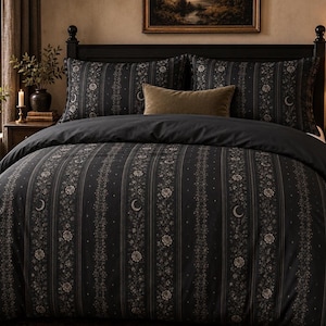 May include: A black duvet cover and two matching pillowcases featuring vertical stripes with floral patterns and crescent moon motifs. A solid dark brown rectangular accent pillow is placed in the center of the bed set.