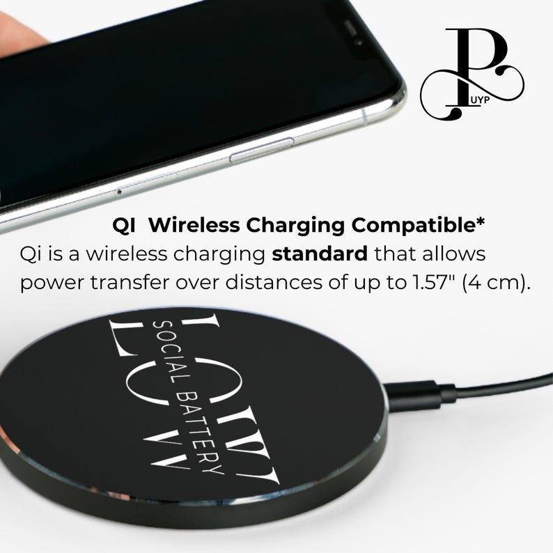 May include: A black wireless charging pad with the text "LUW SOCIAL BATTERY LOW" printed in white. The pad is compatible with Qi wireless charging, which allows for power transfer over distances of up to 1.57 inches (4 cm).