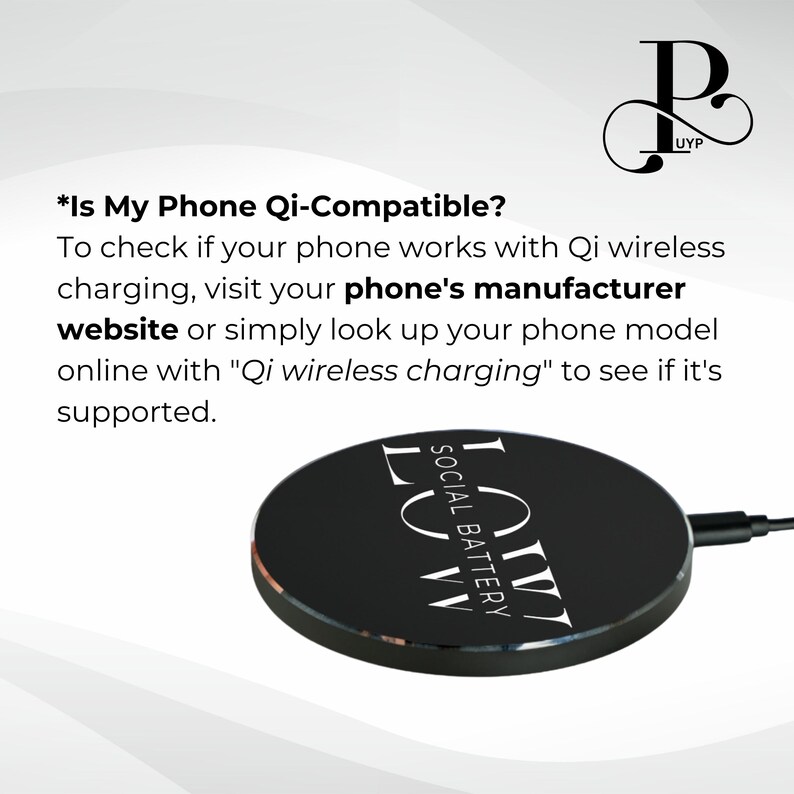 May include: A black wireless charging pad with the text "SOCIAL BATTERY" and "LVW" printed in white. The text "*Is My Phone Qi-Compatible?" is displayed above the charging pad. The text explains that to check if a phone is Qi-compatible, visit the phone's manufacturer website or search online for "Qi wireless charging".