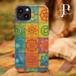 May include: A colorful phone case featuring a patchwork design with various geometric and floral patterns in shades of blue, green, orange, and purple. The case has a stitched appearance and a camera cutout.