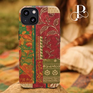 May include: A patterned phone case with a patchwork design. The case features floral and geometric patterns in red, green, orange, and cream. The case is designed to fit a smartphone and has a camera cutout.