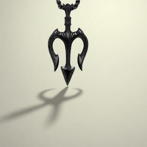 May include: A black trident pendant necklace. The pendant, suspended from a chain, has a central spearhead and curved prongs. The design casts a shadow. The necklace is a dark, gothic style.