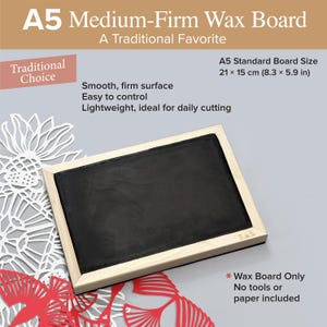 May include: A rectangular A5 medium-firm wax board with a black surface framed in light-colored wood. The board measures 21 x 15 cm (8.3 x 5.9 in). Text on the image includes A5 Medium-Firm Wax Board, A Traditional Favorite, and Traditional Choice.
