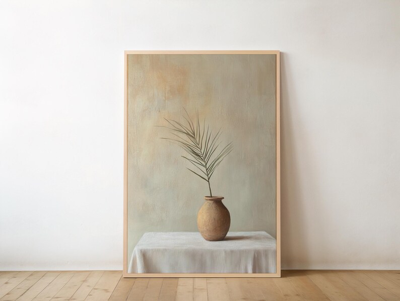 May include: A painting of a single green branch in a terracotta vase on a white tablecloth. The background is a muted green and brown.