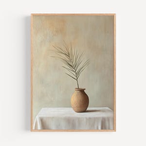 May include: A painting of a single brown branch with green leaves in a terracotta vase on a white tablecloth. The background is a light green and brown textured wall.