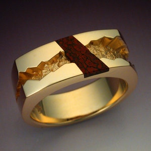 Man's ring inalid with gem Dinosaur Bone