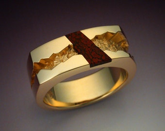 Man's ring inalid with gem Dinosaur Bone