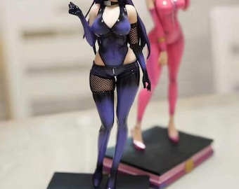 May include: Two anime-style figurines. The first is a woman in a dark purple outfit with black gloves and fishnet stockings. The second is a woman in a pink bodysuit. Both stand on book-shaped bases.