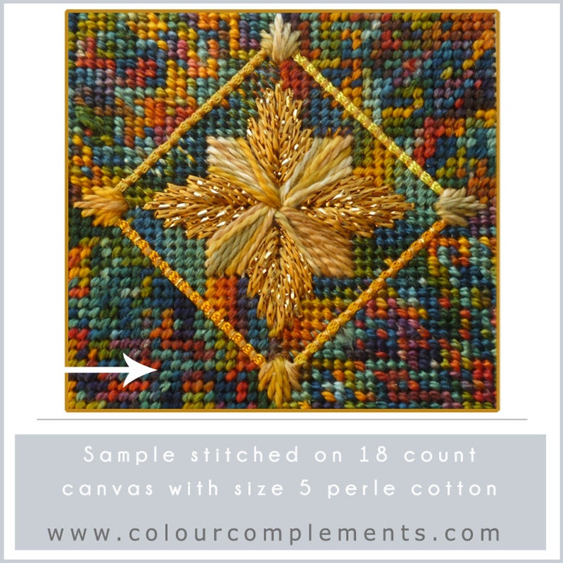 May include: Close-up of a cross-stitch design featuring a gold starburst on a colorful background. The design is stitched on 18 count canvas with size 5 perle cotton. The text "www.colourcomplements.com" is visible below the design.