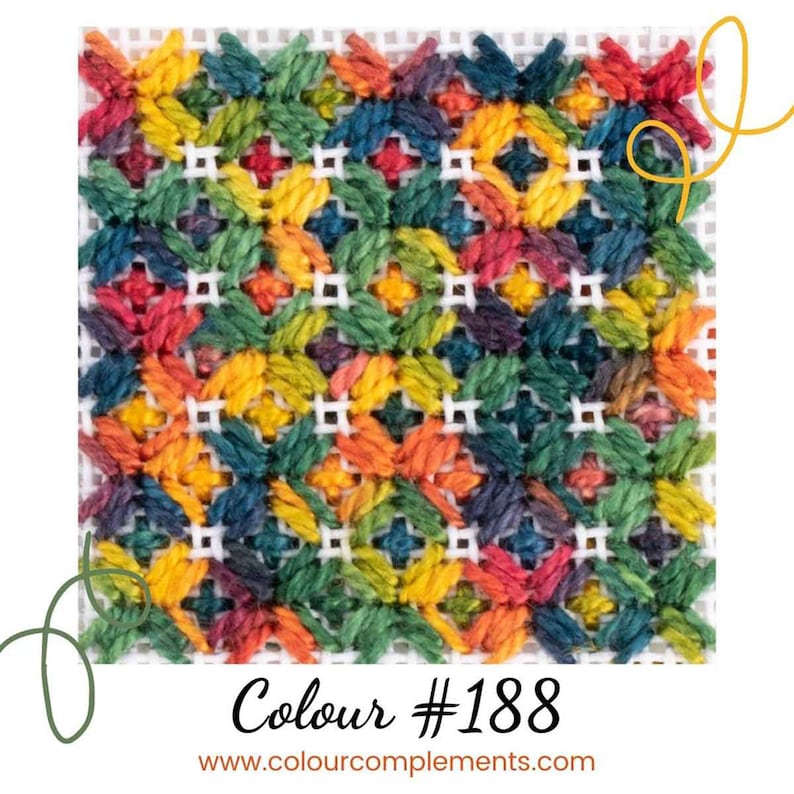 May include: A colorful cross-stitch pattern with a variety of shades of red, orange, yellow, green, blue, and purple. The pattern is stitched on white Aida cloth. The text "Colour #188" and "www.colourcomplements.com" is visible below the pattern.