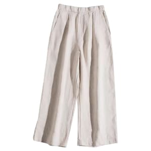 May include: Cream-colored wide-leg pants with a high waist and pleats. The pants have two front pockets and a relaxed fit. The fabric appears to be a lightweight linen or cotton blend, suitable for warm weather. The pants are designed for comfort and style.