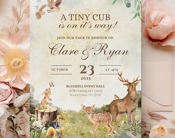 May include: A woodland-themed baby shower invitation with a light green background. The invitation features a brown deer, a fawn, a rabbit, and a bird. The text reads "A Tiny Cub is on it's way!"  "Join our pack in honour of Clare & Ryan" "October 23, 2025 at 4pm" "Bluebell Event Hall 5678 Harmony Lane Rivertown, NY 12950"