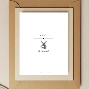 May include: A white card with a black illustration of a windmill, the text "Made with love", and "The Paper Windmill" in a brown envelope. The card has a heart symbol above the windmill illustration. The Etsy shop URL is at the bottom.