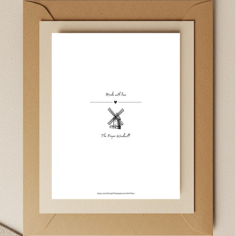 May include: A white card with black text that reads "Made with love" and a small black heart symbol. Below the text is a black and white illustration of a windmill. Below the windmill is the text "The Paper Windmill" and the website address "etsy.com/shop/thepaperwindmillco".